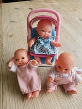 3 X Small Baby Dolls + A Stroller