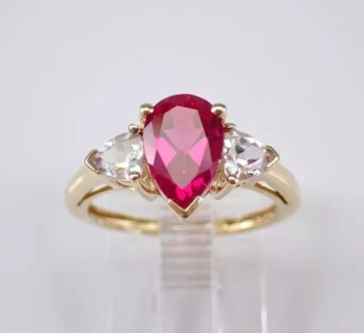 2Ct Pear Cut Simulated Ruby Women's Three Stone Ring In 14k Yellow Gold Plated