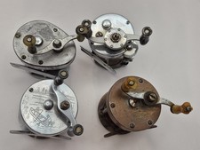 4-Fishing Reel And 4 Handle Bundle. All Reels Made In The USA. Good Condition