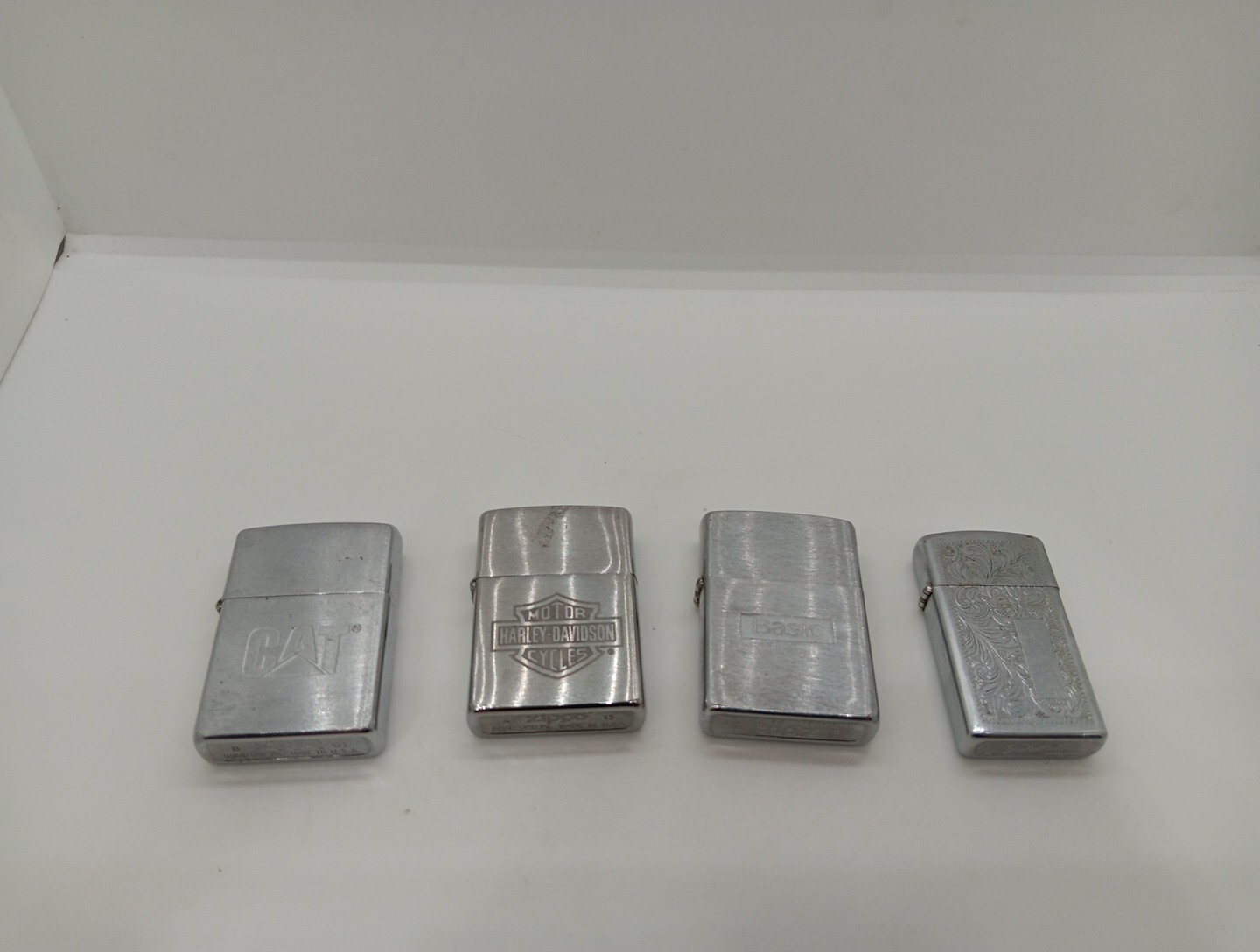 Vintage Zippo Lighter lot Of 4. CAT Caterpillar, Harley Davidson, Basic