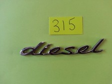 USED Genuine Porsche diesel bright silver chrome Plastic Badge.  958559500100C1