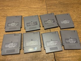 Lot of 8 Nintendo NES games including Mega Man 2 And 3 Mario 2 And 3 WWF Etc