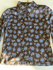 Brown and blue County Seat ladies shirt size M with floral print, button front, and “Made in USA” label on neckline.
