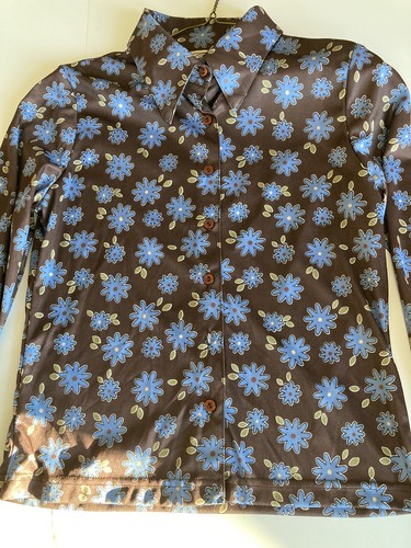 Brown and blue County Seat ladies shirt size M with floral print, button front, and “Made in USA” label on neckline.