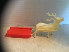 Vintage Christmas Celluloid White Reindeer Pulling Red Plastic Sled