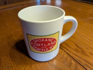 NEW WHISTLE STOP MUG WITH SPOKANE PORTLAND & SEATTLE RR LOGO