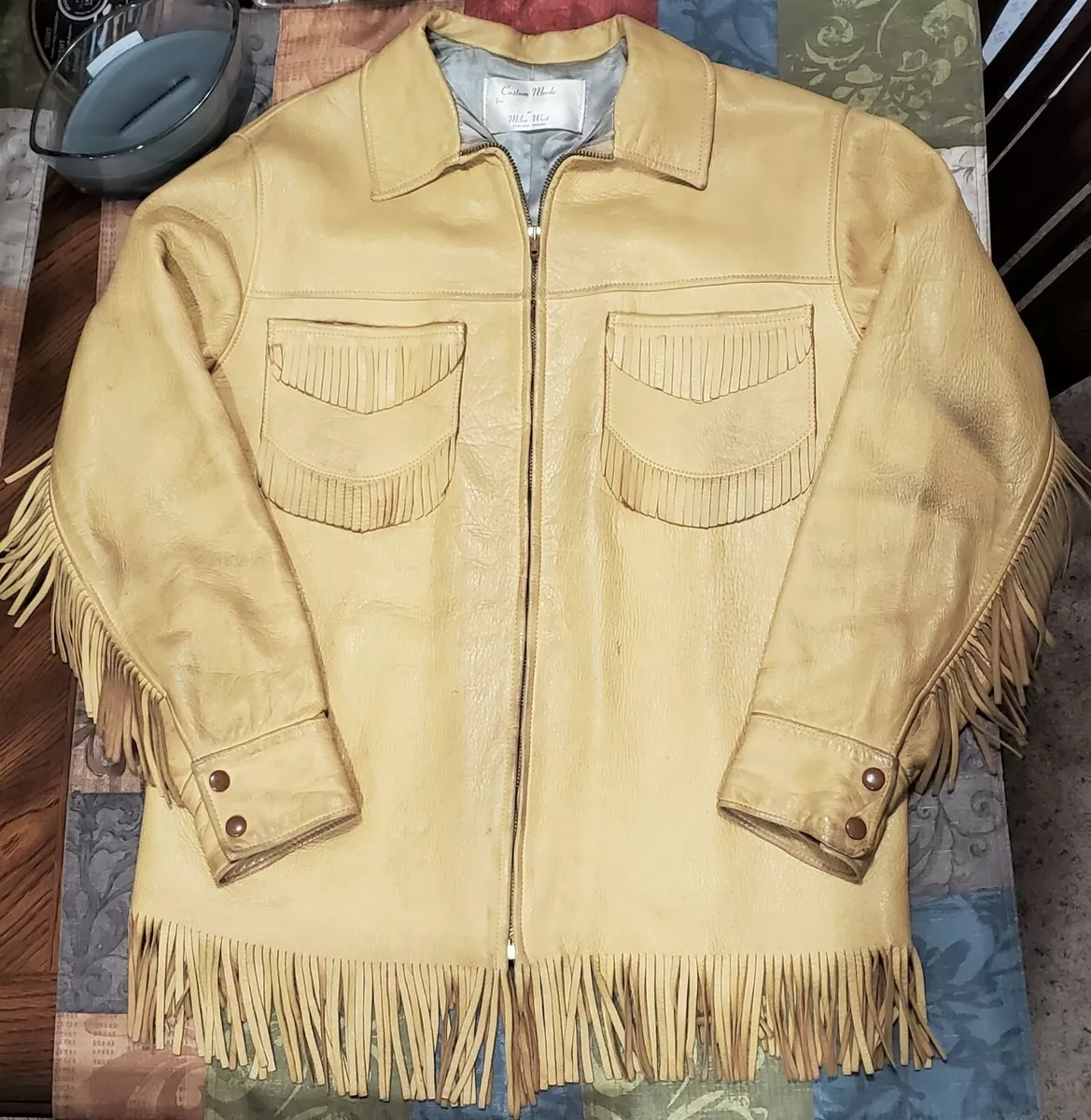 Tan Western style leather jacket with fringe