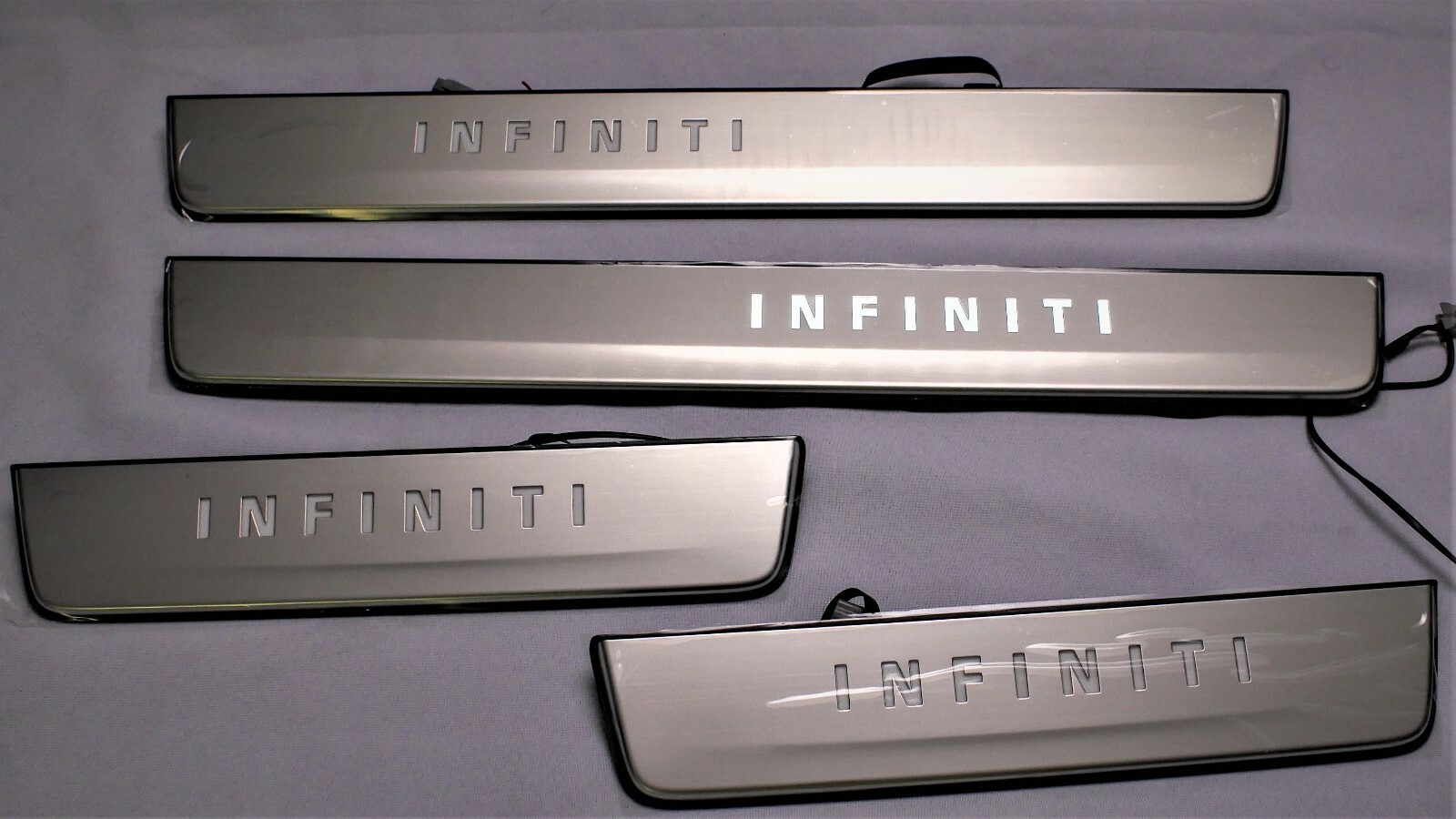 NEW OEM INFINITI QX80 RADIANT ILLUMINATED DOOR SILL KICK PLATES 999G6