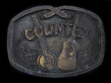 TA03109 VINTAGE 1976  COUNTRY MUSIC  COMMEMORATIVE BRASSTONE BELT BUCKLE