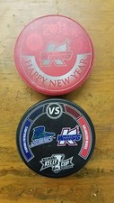 Kalamazoo Wings Hockey Pucks - Happy New Year and Kelly Cup Puck - Used 2011