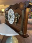 Wooden mantel clock with porcelain dial and gilt bronze cherub decorations — photo 2