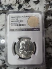 1953 Franklin Half Dollar 50c BU. 90% Silver. NGC Slabbed With Bag Fragment.
