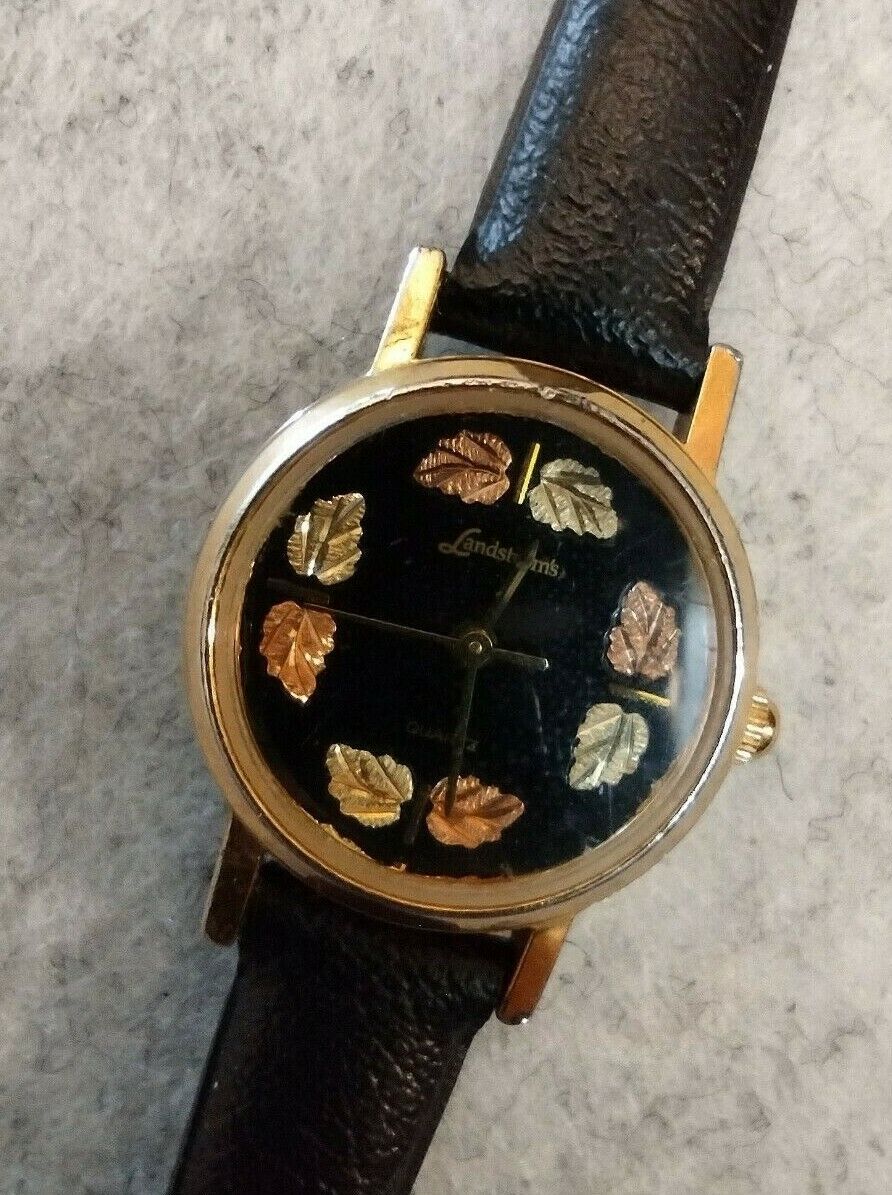 Landstrom's® Ladies Black Face Watch with Leather Band and 12K Gold Leaves