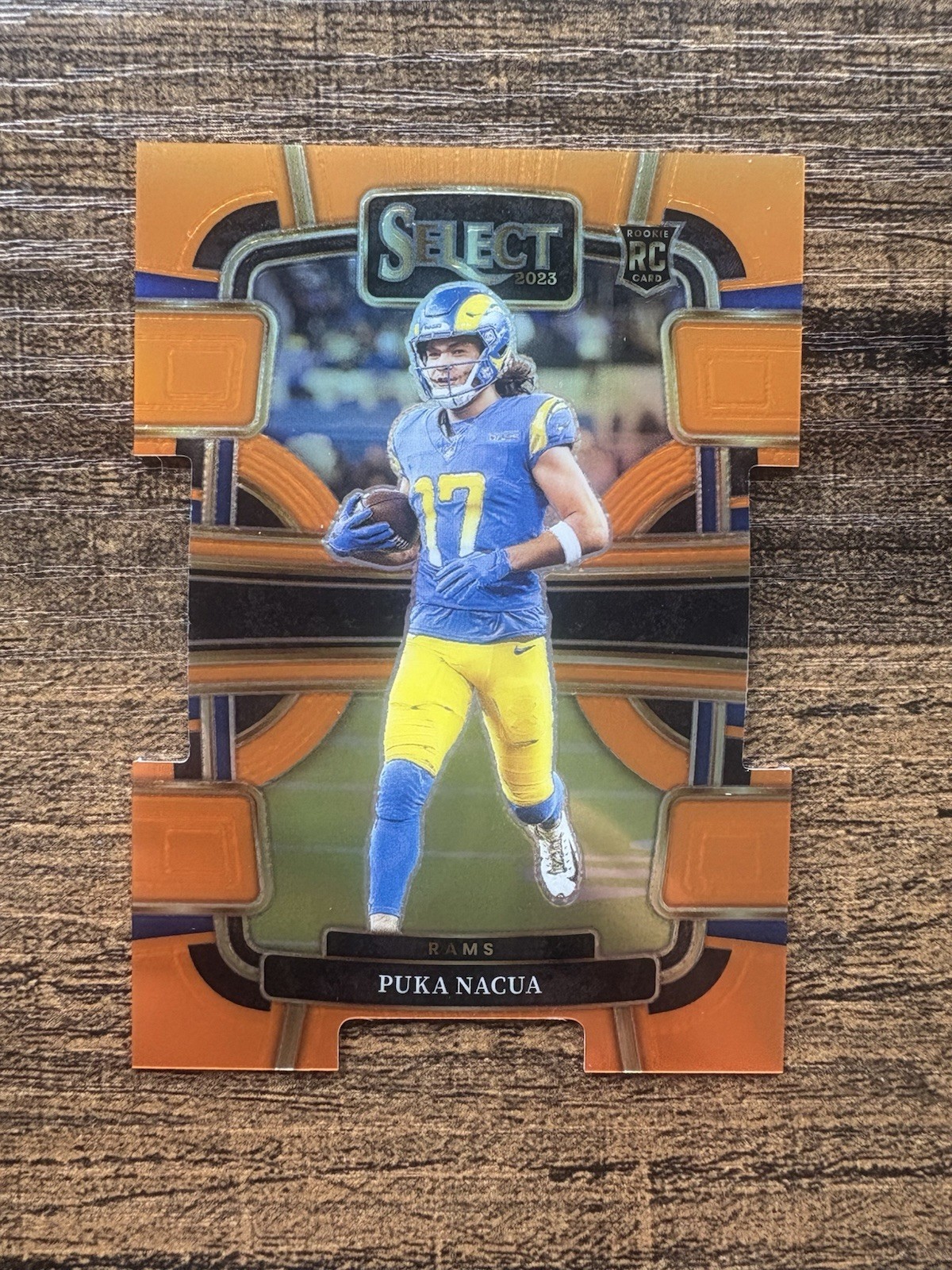 2023 Panini Select - Concourse Puka Nacua #56 Orange Prizm Die-Cut /499 (RC)