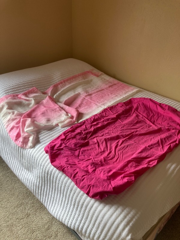 Pink toddler bed fitted sheet and window curtain