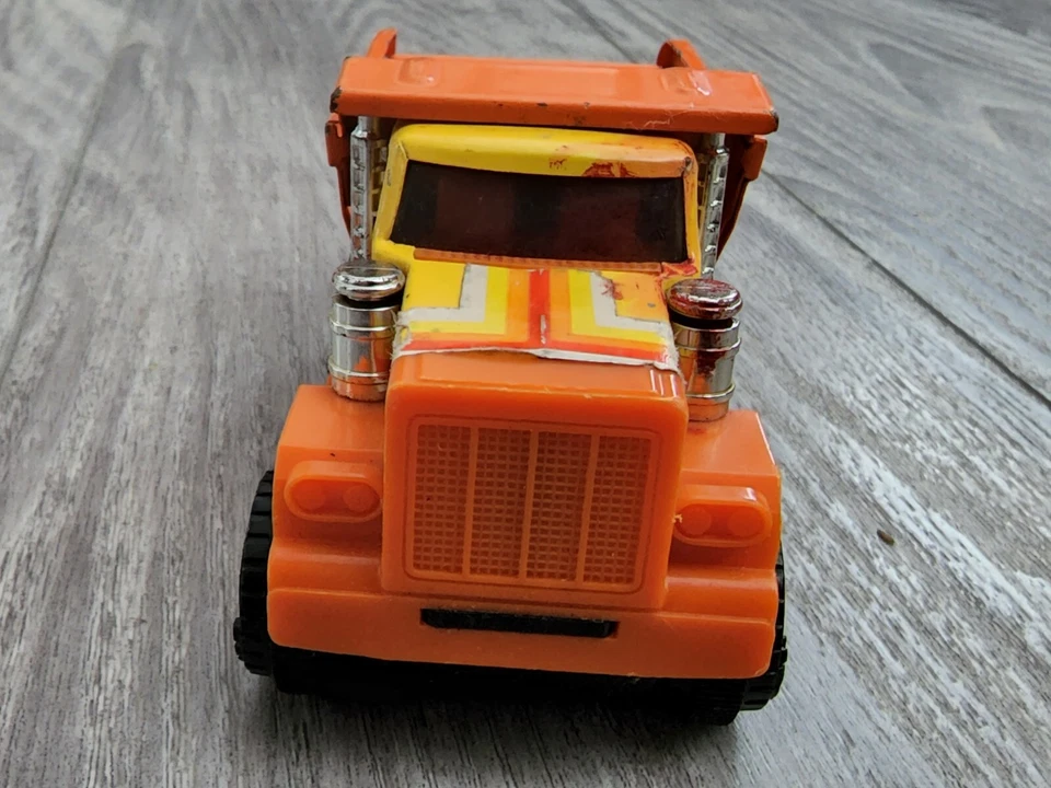 Vintage ERTL Pressed Steel / Plastic Dump Powerized Truck Friction Motor Orange - Image 3 of 4