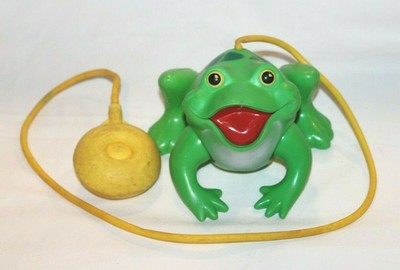 squeeze bulb jumping frog toy