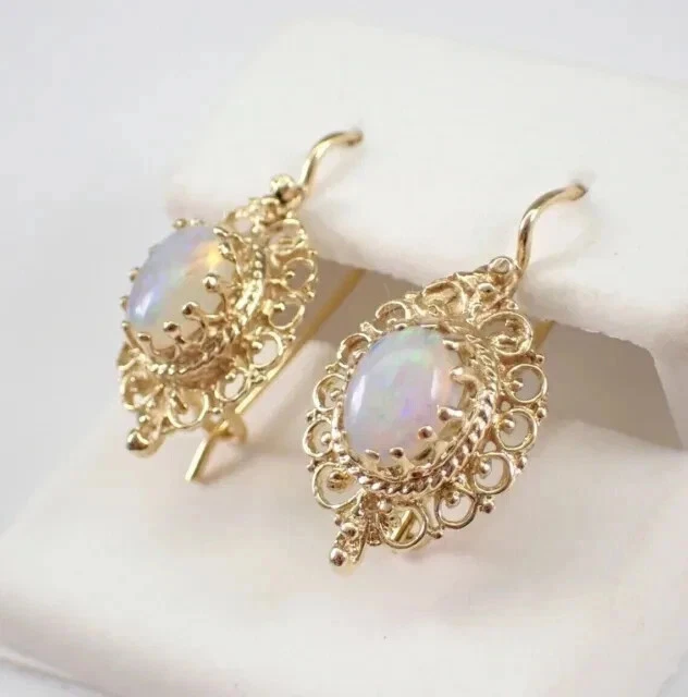Pendientes colgantes vintage de ópalo de fuego natural de 3 quilates de corte ovalado enchapados en oro amarillo de 14 quilates Foto 3 de 4