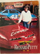 RICHARD PETTY SIGNED BROCHURE, WITH 43 PONTIAC IN BACKGROUND.