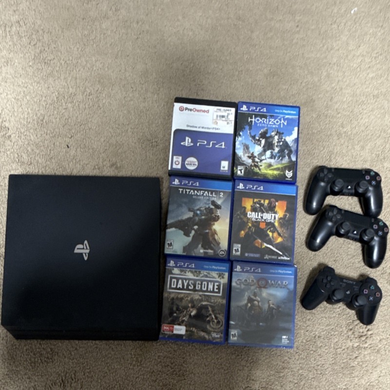 Sony PS4 (1TB)Pro Console with 3 Controllers & 6 Games