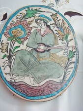 Antique Middle Eastern A Pottery Glazed Oval Tile Woman Playing Instrument