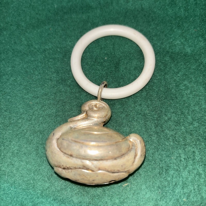Silver plated vintage baby duck rattle on plastic ring