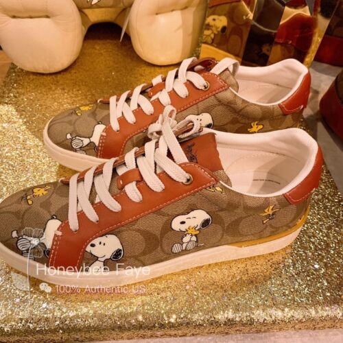 Neu mit Etikett Coach X Peanuts Damenclip Low Top Sneaker mit Snoopy Woodstock Druck - Bild 1 von 12