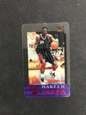 1996 Classic Clear Assets #17 Hakeem Olajuwon Phone Cards $2 Houston Rockets