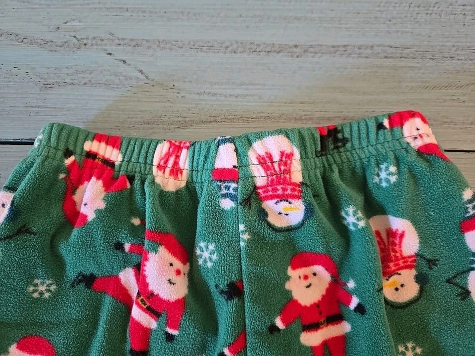 Pantalones de pijama CARTER'S verde polar estampado de Papá Noel y muñeco de nieve niños niñas talla 12 meses Foto 4 de 4