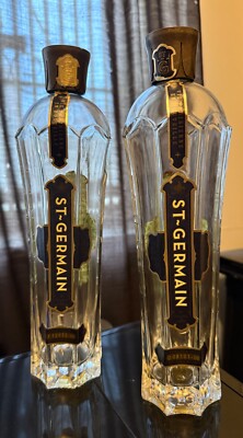 Pair of empty pre-owned St-Germain 750ml liqueur bottles, Art Deco shape, w/caps