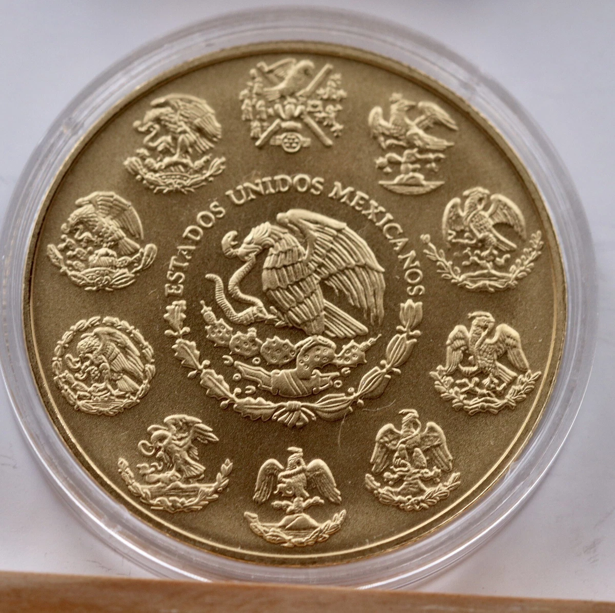 UNA ONZA DE MÉXICO DE PLATA BAŃADA EN ORO DE 24 QUILATES