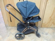 CYBEX PRIAM STROLLER WITH ROSE GOLD FRAME AND PREMIUM BLACK SEAT