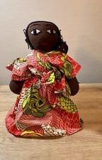 A handcrafted rag doll depicting a mother and child in African Print