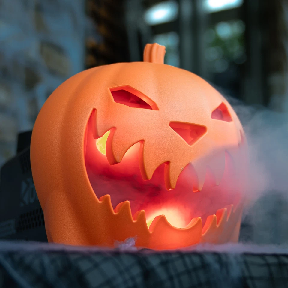 A plastic pumpkin that looks scarey with smoke coming from it's mouth