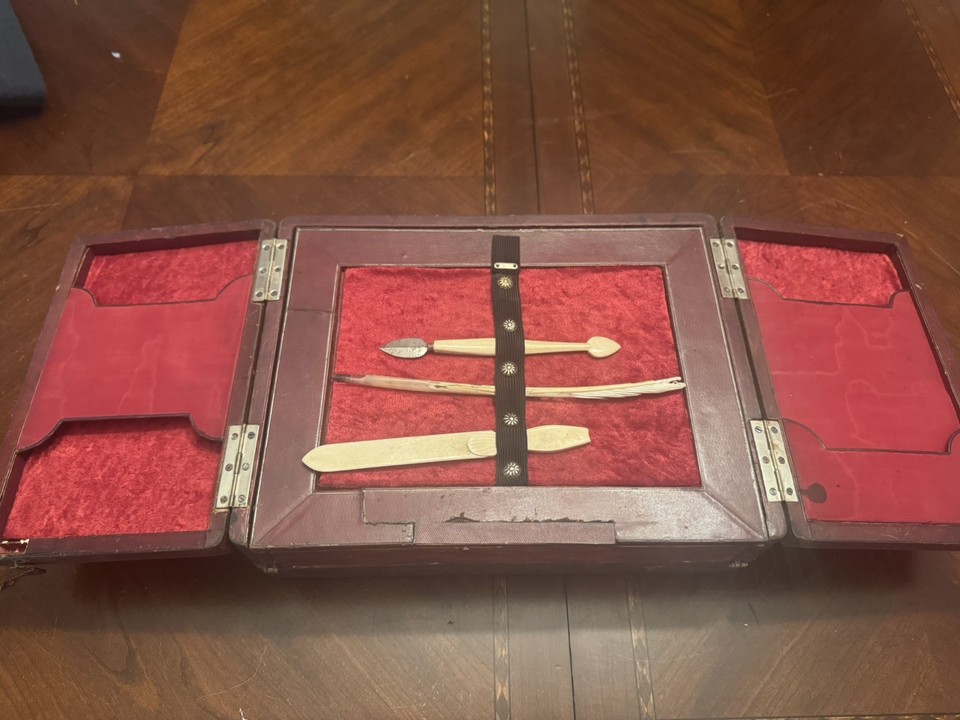 A Victorian-era traveling writing slope complete with tools — a self-contained portable writing desk that predates laptops by 150 years and looks incredible open on a shelf.