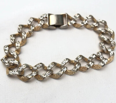 Goldfarbenes Kettenarmband mit silberfarbenem Sternenmuster signiert unbekanntes SymbolA3