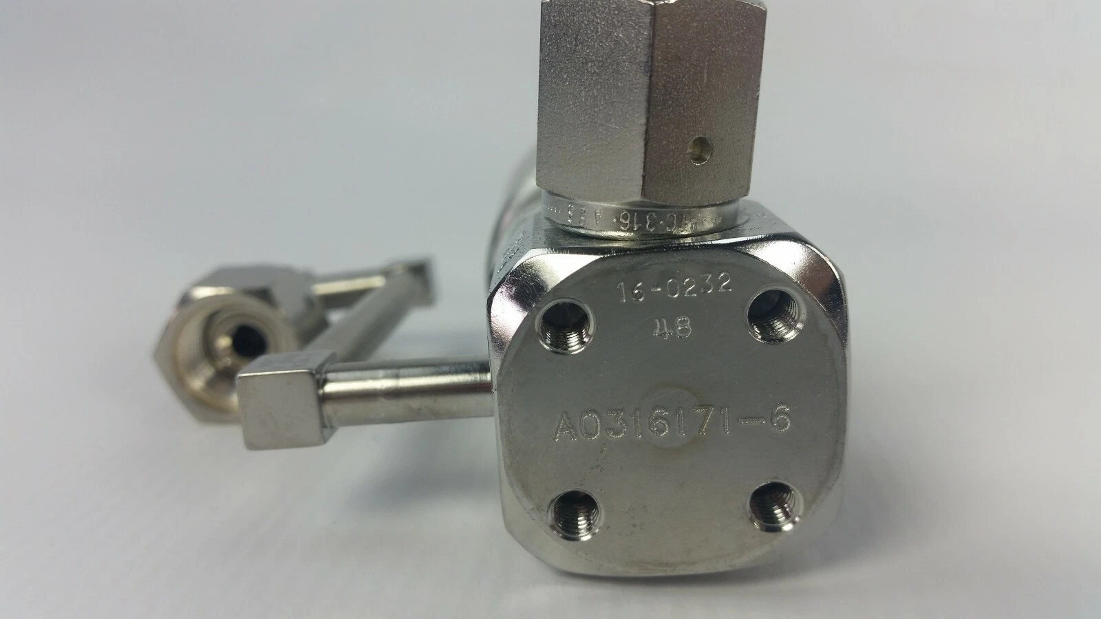 Bottom of the valve body marked A0316171-6 with four tapped holes