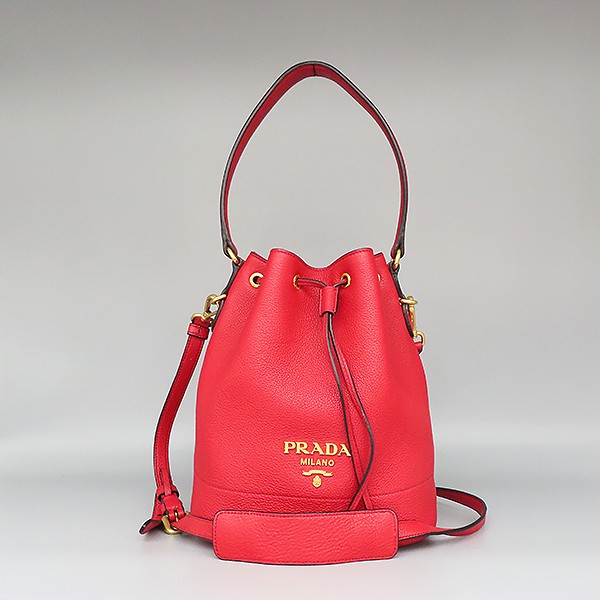 Prada Vitello Daino Nero red leather gold logo bucket tote with crossbody strap