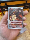 Team Rocket's Meowth 203/182 Sv10: Destined Rivals Holo