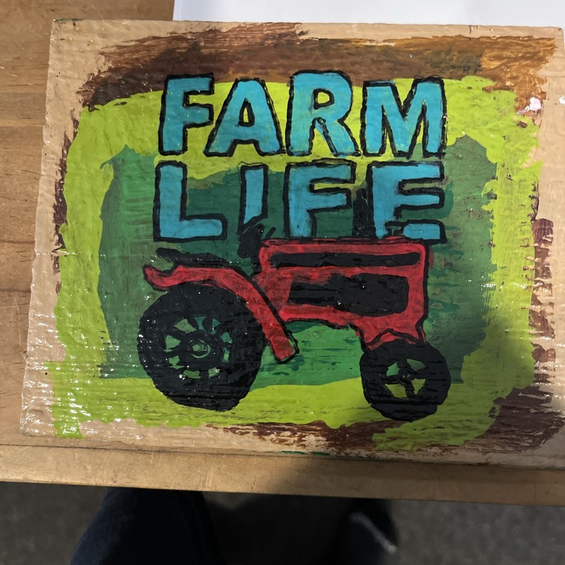 A Hand Painted Piece Or Wood. With A Tractor And The Words Farm Life
