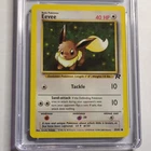 CGC 8 Eevee 55/82 Team Rocket Unlimited 2000 WOTC Pokémon TCG