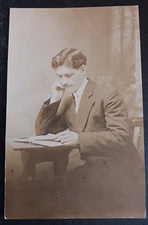 vtg postcard RPPC Swingle's Photo Studio Art Shop Peckville PA dapper man reads