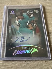 2023 PANINI LUMINANCE #27 TRAVIS ETIENNE JR. AUTO GOLD 010 /100