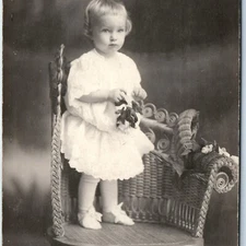 1910s Adorable Little Girl RPPC Cute Baby Wicker Flower Real Photo Postcard A121