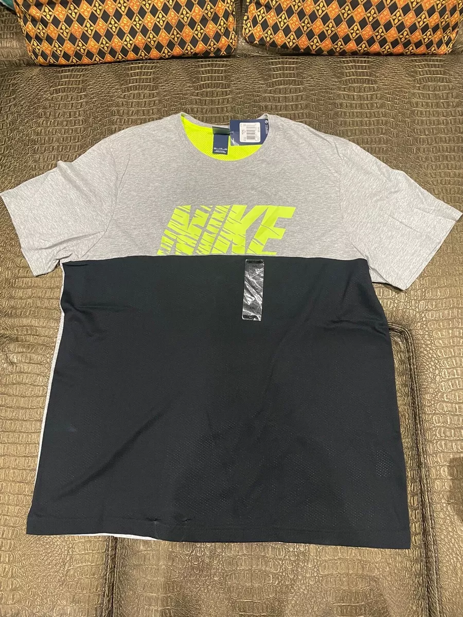 grey and yellow nike shirt