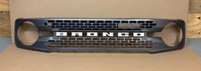OEM FORD BRONCO 2021- 2024 GRILLE CARBONIZED GRAY WHITE LETTERING BADLANDS