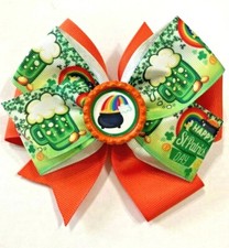 Beautiful St. Patrick's Day Rainbow pot of gold inspired hair bow for girls.
