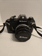 Nikon EM 35mm SLR Film Camera lens And Casing. Rubber Around Lens Is Messed Up.