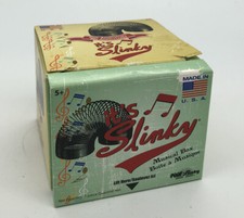 Slinky 50th Anniversery Slinky and Music Box. Like New Condition.