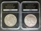 Two 1935 $1 Peace Silver Dollars in Slabs, One is 3 Rays and One is 4 Rays